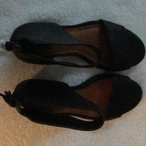 Black leather open toe, back zipper booties.